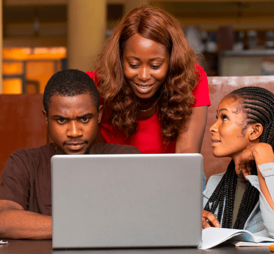 Students working through a coding exercise together